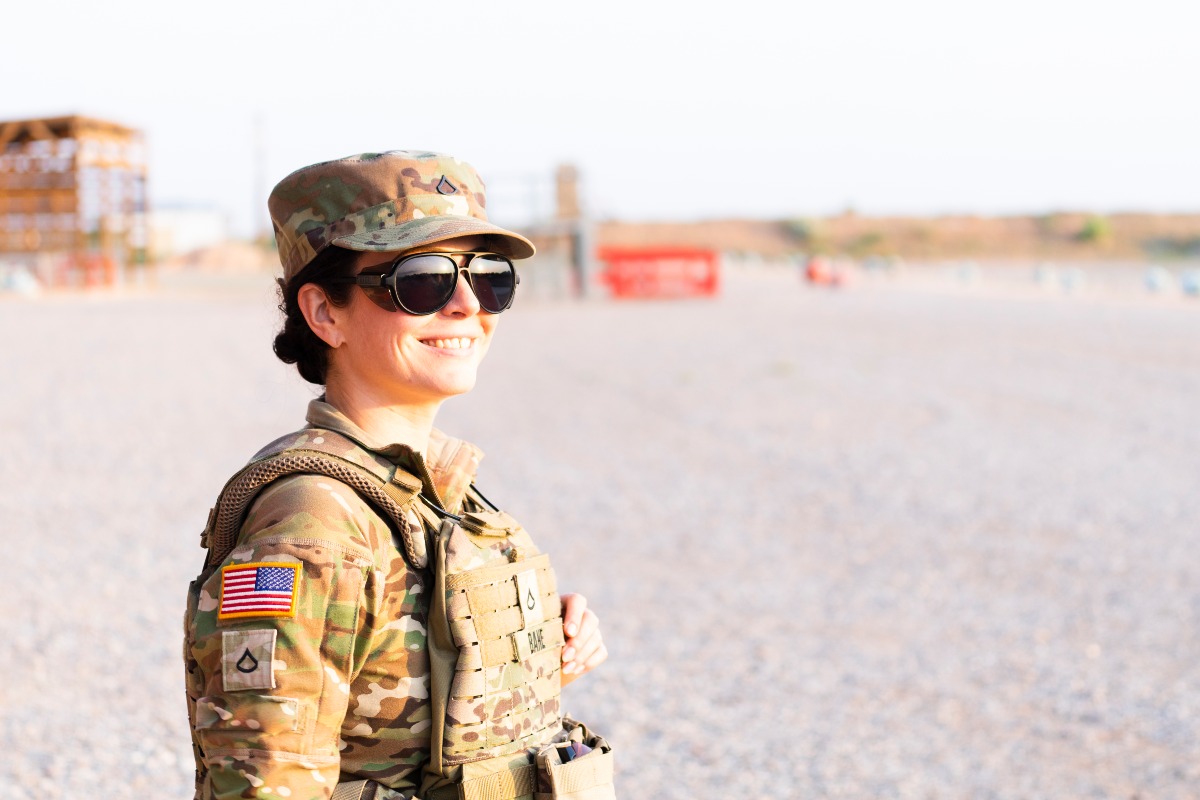 A smiling female soldier, showing the hope and resilience found through veteran mental health support.