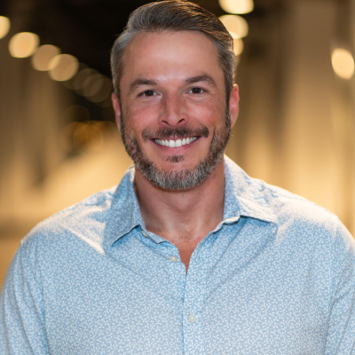 Kevin, a smiling and professional leader on our addiction recovery team, dedicated to client success.